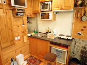 a small kitchen with a sink and a counter at Ski liviomoritz at gma il com Chalet in Madzhare