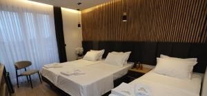 Postel nebo postele na pokoji v ubytování Hotel Luna