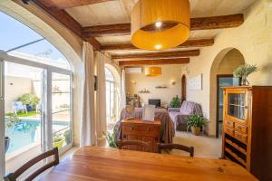 A seating area at 4 Bedroom Holiday Home with Private Pool