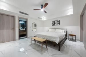 a bedroom with a bed and a ceiling fan at Apartamento nuevo Cap Cana in Punta Cana +15 photos