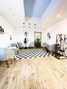 a room with two beds and a checkered floor at Al Borj Hotel فندق البرج 