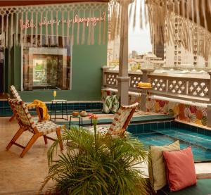 a living room with two chairs and a pool at Townhouse Boutique Hotel in Cartagena de Indias