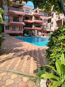 The swimming pool at or close to Kyle Calangute 1 bhk luxury apartment with pool