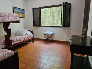 a living room with a couch and a window at Villa Arbolada in San Lorenzo +57 photos