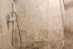a shower with a shower head in a bathroom at Luxury 105 Studio in Casablanca