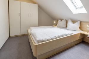 a bedroom with a bed and a skylight at Gasthof _ Pension _ Drei Linden in Pegnitz