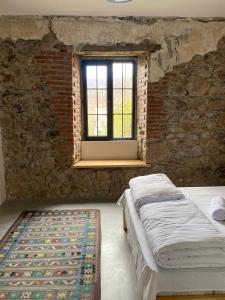 a bedroom with two beds and a window at Filijan Gallary in Dilijan +27 photos