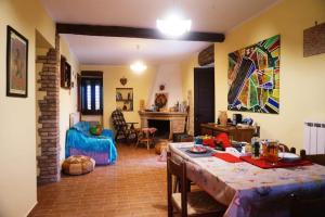a living room with a table and a living room with a couch at La Campagna del Benessere in Gildone