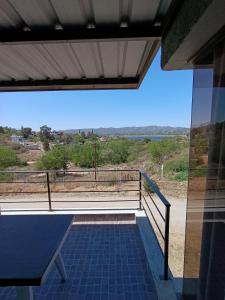 a view from the balcony of a house at Complejo Refugio Playa Perelli in Villa Carlos Paz