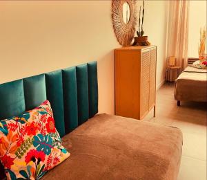 a bedroom with a couch with a pillow on it at MoryńApartments R20 in Moryń