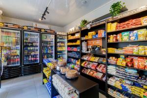 a grocery store aisle with food on the shelves at Apto 2 dorm I Prox ao Transamérica Expo e Vibra SP in Sao Paulo