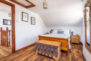 Ένα ή περισσότερα κρεβάτια σε δωμάτιο στο The Hideaway Muff