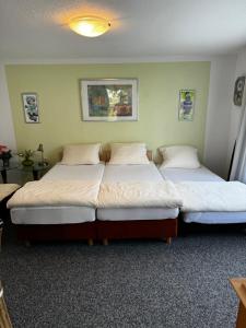 two beds sitting in a room with at Melissa in Itzehoe