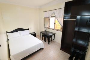 En eller flere senger på et rom på Hotel mekka sud + 9 bilder