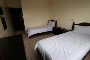 En eller flere senger på et rom på Hotel mekka sud