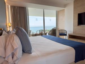 Postel nebo postele na pokoji v ubytování Hotel Irotama Lago