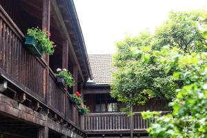 a building with flower boxes on the balconies at Pferdehof-Jauerling in Maria Laach am Jauerling +8 photos