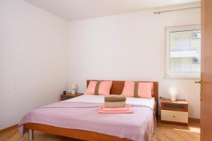 Postel nebo postele na pokoji v ubytování Apartment Eli