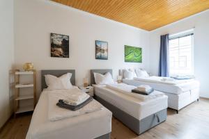 A bed or beds in a room at Stilvolle Stadtwohnung in Leoben