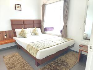 Postel nebo postele na pokoji v ubytování Chandralok Service Apartments + 37 fotografií