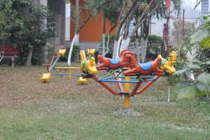 a group of childrens play equipment in a park at Rose wood point in Chālsa Mahābāri