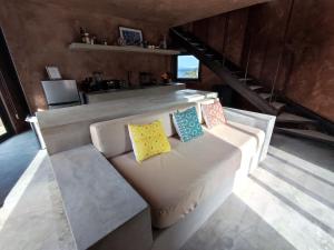 a living room with a couch with pillows on it at Casa Nacui 1 in El Sargento