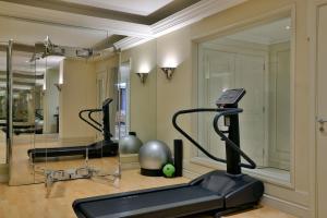 a gym with two exercise bikes and a treadmill at The Westin Dubai Mina Seyahi Beach Resort and Waterpark in Dubai