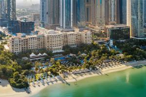 an aerial view of a resort with a beach and buildings at The Westin Dubai Mina Seyahi Beach Resort and Waterpark in Dubai