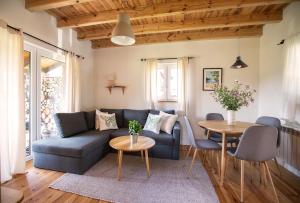 a living room with a couch and a table at Kartkówka in Unichowo