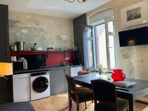 a kitchen with a table and a dining room at Vis-a-vis Apartments in Traben-Trarbach