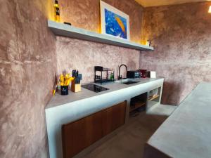 a kitchen with a counter with a sink in it at Estudio Nacui in El Sargento