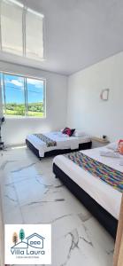 Кровать или кровати в номере Villa Laura Resort, Carmen de Apicala +29 фотографий