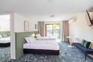 Postel nebo postele na pokoji v ubytování Currimundi Hotel + 37 fotografií