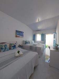 Postel nebo postele na pokoji v ubytování Casa Grécia Jericoacoara