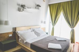 Postel nebo postele na pokoji v ubytování Bio Hotel Palermo