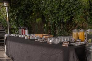 a black table with glasses and drinks on it at Hotel Boutique 17 in Valparaíso