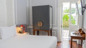 Cama ou camas em um quarto em Casa Republica Barranco Boutique Hotel
