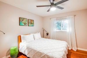 a bedroom with a bed and a ceiling fan at Pet-Friendly Home - 3 Mi to University of Florida! in Gainesville