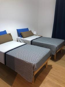 Postel nebo postele na pokoji v ubytování Dimora 4CavallucciMarini