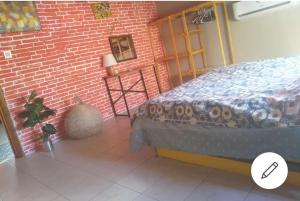 a room with a bed and a brick wall at City Center by Harbour First Floor in Marmaris +25 photos