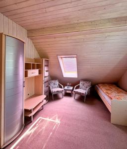 A bed or beds in a room at Chalupa Miška
