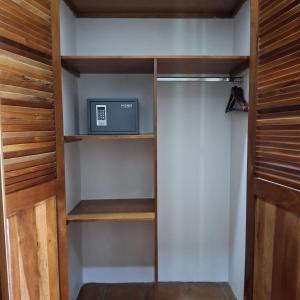 a walk in closet with a television in it at Hotel Jardín Garden de Granada Nicaragua in Granada