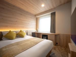 Ένα ή περισσότερα κρεβάτια σε δωμάτιο στο JR-East Hotel Mets Fukushima +29 φωτογραφίες