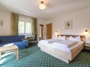 A bed or beds in a room at Ferienhaus Haas I
