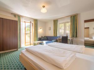 A bed or beds in a room at Ferienhaus Haas I