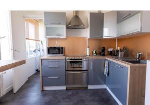 Kuchyň nebo kuchyňský kout v ubytování Appartement fonctionnel, balcon ,2 minutes gare ,17 minutes Paris + 7 fotografií