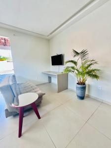 TV a/nebo společenská místnost v ubytování Conforto e sossego próximo à praia + 9 fotografií