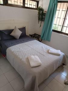 Ένα ή περισσότερα κρεβάτια σε δωμάτιο στο Casa Pok Ta Pok +7 φωτογραφίες