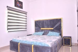 Postel nebo postele na pokoji v ubytování Shine Residence