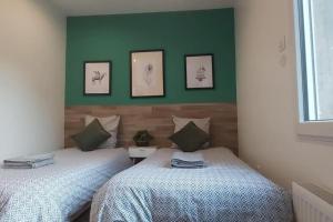 Ένα ή περισσότερα κρεβάτια σε δωμάτιο στο Les Suite Appartement à Chalon sur Saône